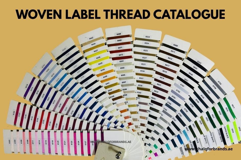 Woven label thread colour catalogue from Khalq for Brands Dubai,UAE, displaying over 100 thread shades in a fan layout. Includes black, white, red, blue, green, pink, gold, and more—used for custom woven labels in Dubai, Sharjah, Abu Dhabi, and across the UAE.