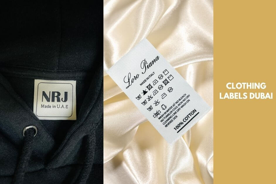 A blog banner image showcasing two types of custom apparel labels. On the left, a woven clothing label stitched inside a black hoodie reads "NRJ Made in U.A.E." On the right, a satin care label for "Loro Piana" is placed on luxurious cream fabric, displaying detailed laundry symbols and "100% Cotton" printed at the bottom. The background features a gold panel with bold white text that reads "Clothing Labels Dubai." The image visually highlights high-quality custom apparel labels in the UAE.
