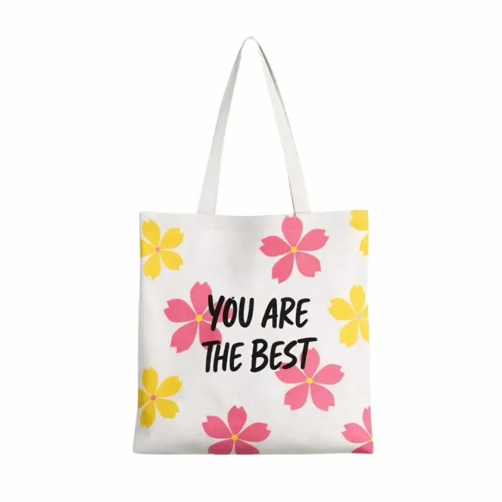 White tote-style non-woven bag with long shoulder handles, printed with colorful floral patterns and the text “You Are The Best” on the front, designed for custom promotional use in Dubai, UAE.